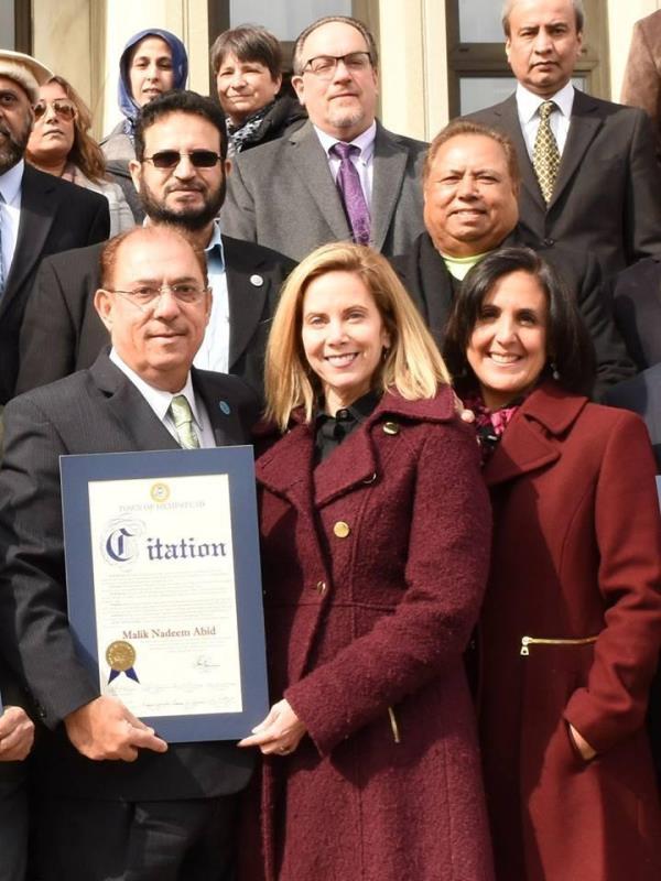 Ambassador Dr. Malik Nadeem Abid and other prominent figures posing for a photo at an event by the International Human Rights Commission, New York