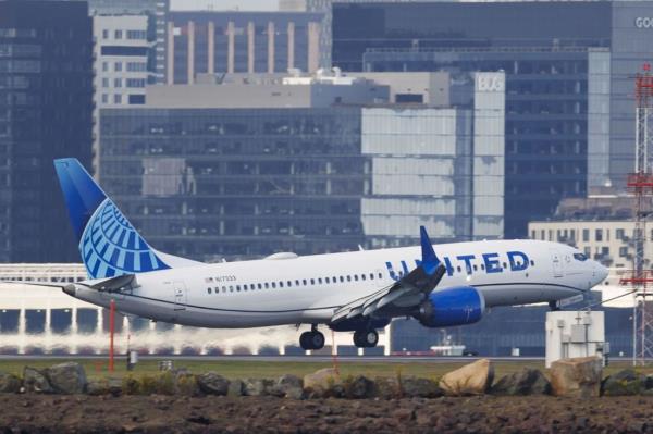 A United Airlines Boeing 737 Max 8 lands at Boston Logan International Airport in East Boston, Massachusetts, USA, 27 September 2024