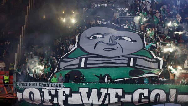 Maccabi Haifa supporters cheer their team during a Europa League match.